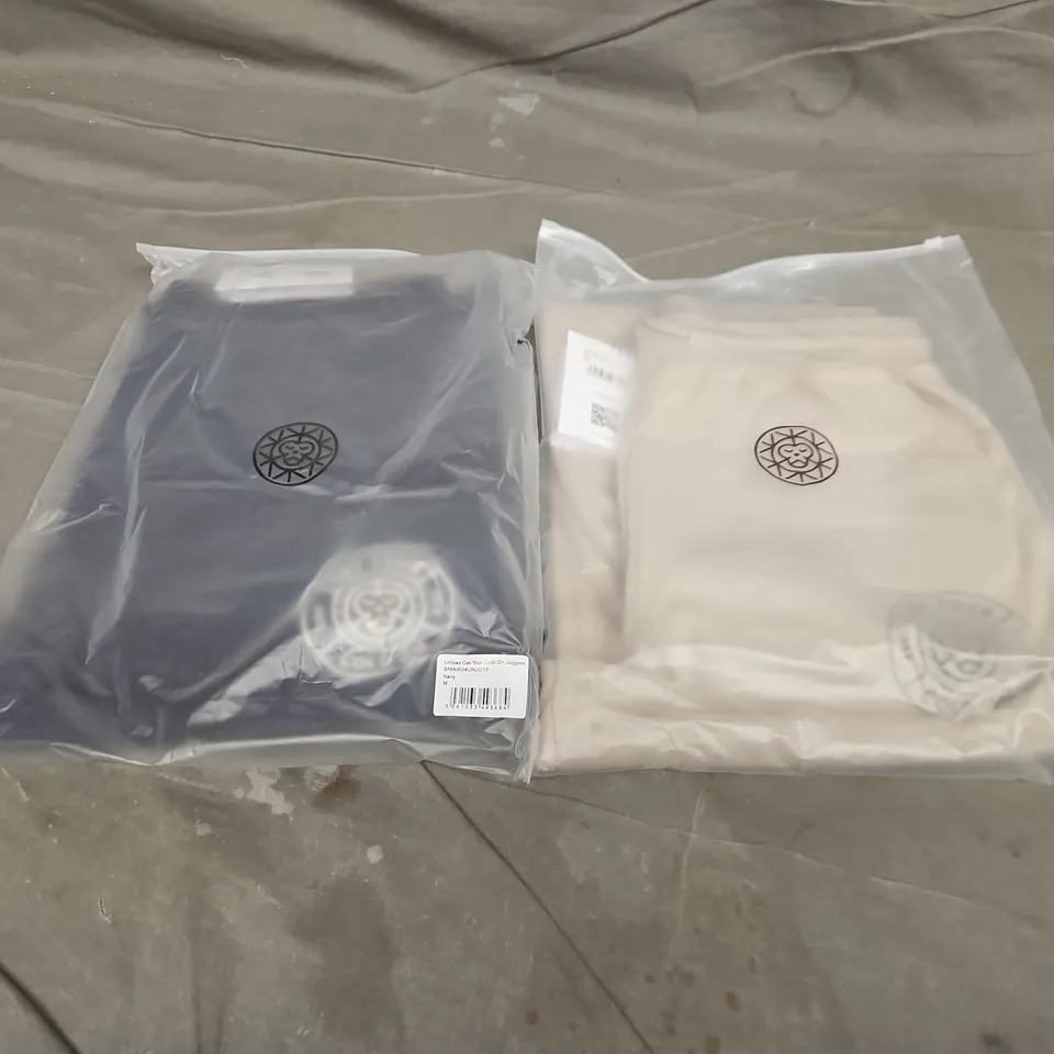 APPROXIMATELY 20 ASSORTED BAGGED UNISEX GET YOUR COLD ON JOGGERS IN VARIOUS SIZES TO INCLUDE COLOURS SUCH AS NAVY, CLAY