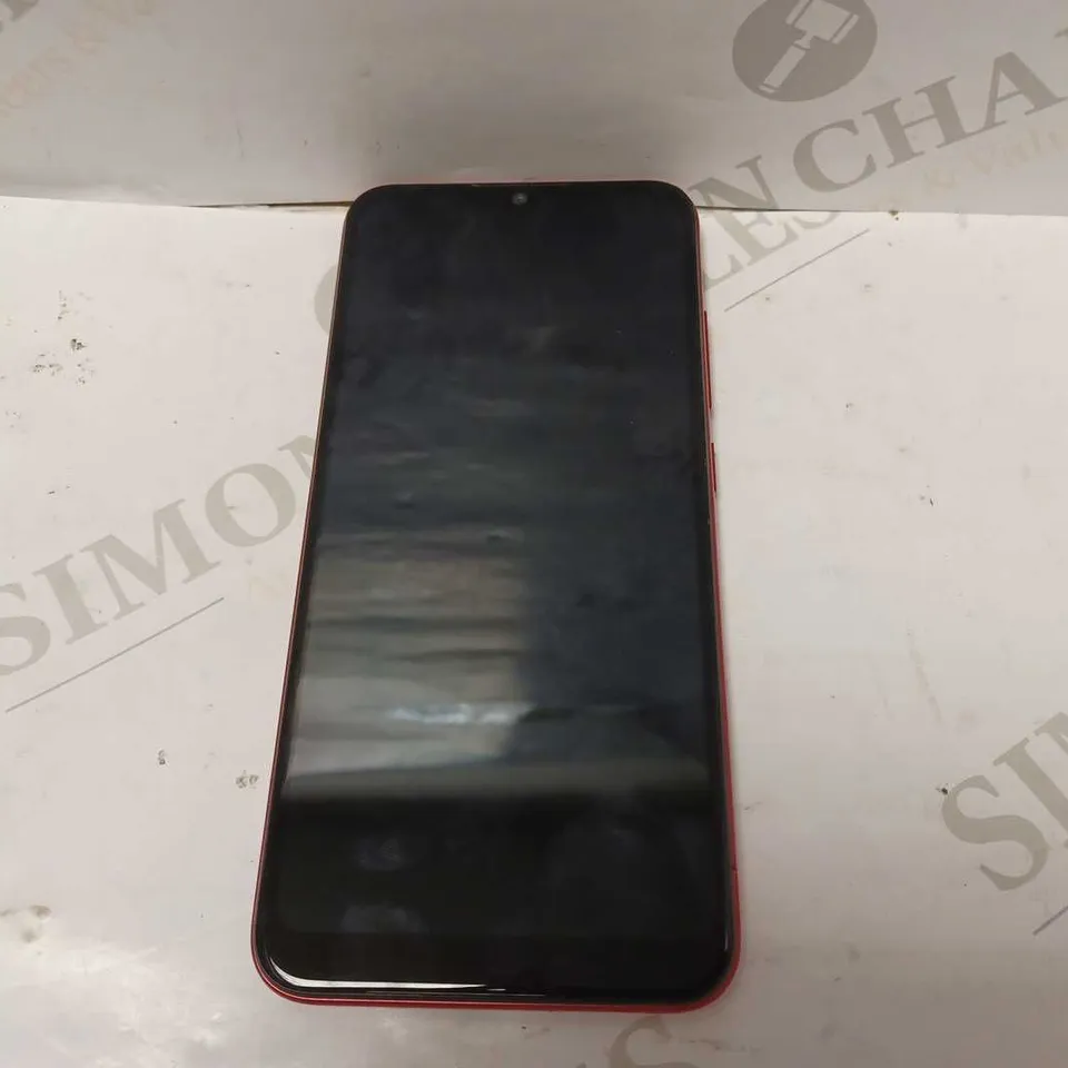 MOTOROLA PHONE IN RED - MODEL UNKNOWN