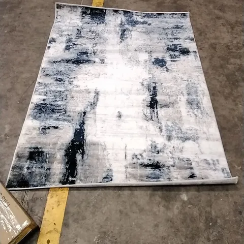 ABSTRACT AREA RUG APPROXIMATELY 120X170CM 