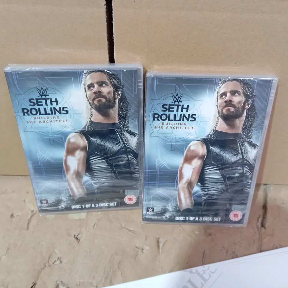 LOT OF 2 SETH ROLLINS DVDS AND ASSORTED REMOTE BACK CASES