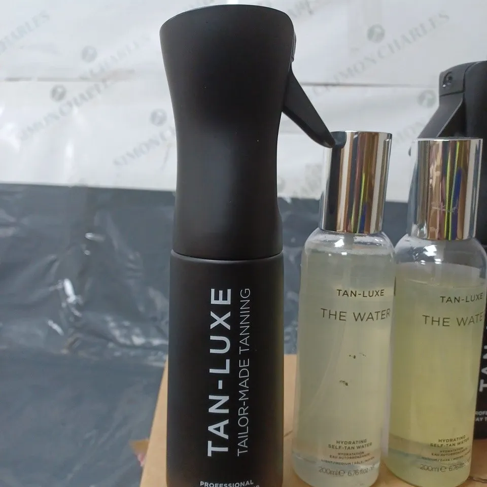 LOT CONTAINING TAN-LUXE BOTTLES TO INCLUDE THE WATER AND 2 SPRAY TAN MIST BOTTLES