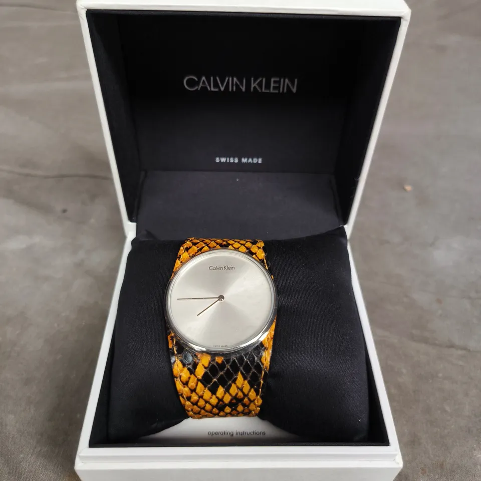 CALVIN KLEIN SWISS MADE WRISTWATCH – ORANGE SNAKESKIN-PATTERN STRAP