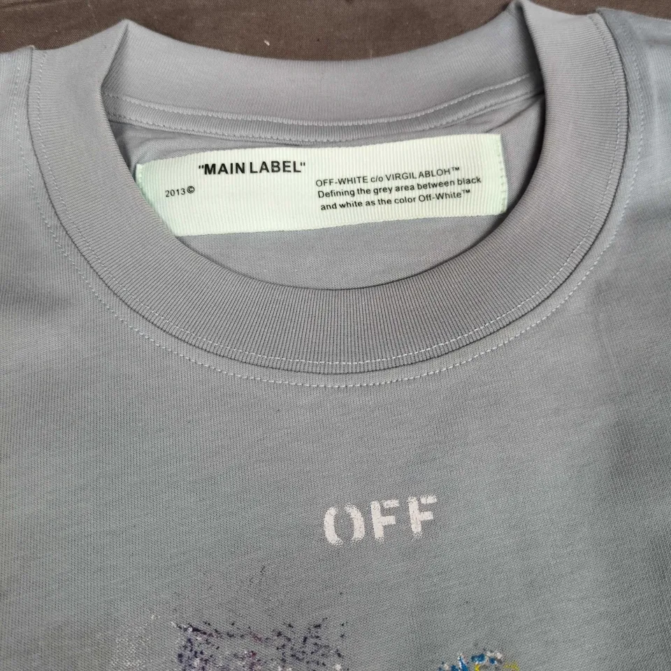 OFF-WHITE C/O VIRGIL ABLOH TEE – LIGHT BLUE/GRAY COTTON WITH PAINT-SPLATTER PRINT, SIZE S (VERIFY MODEL)