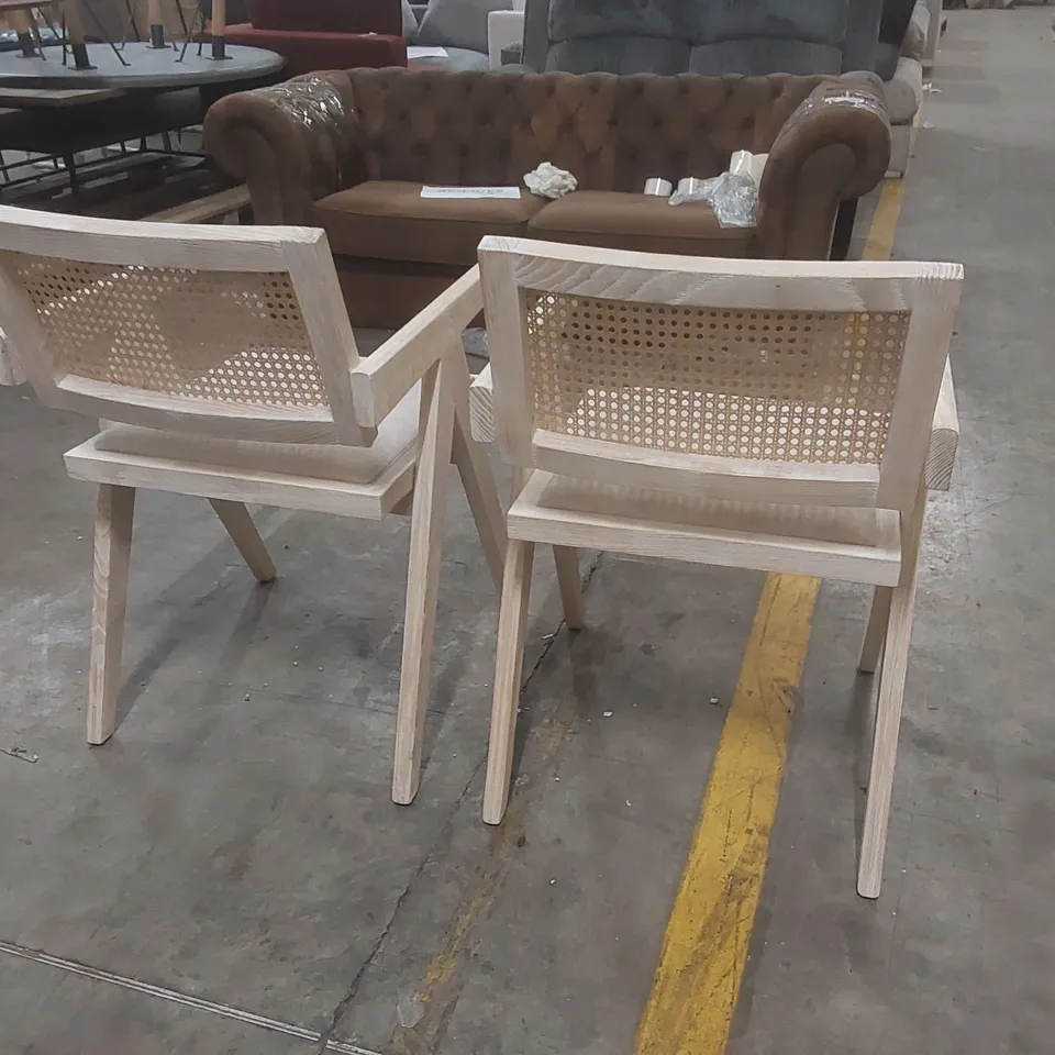 PAIR OF DESIGNER SOLID WOOD DINING CHAIRS WITH RATTAN BACK AND PADDED SEAT