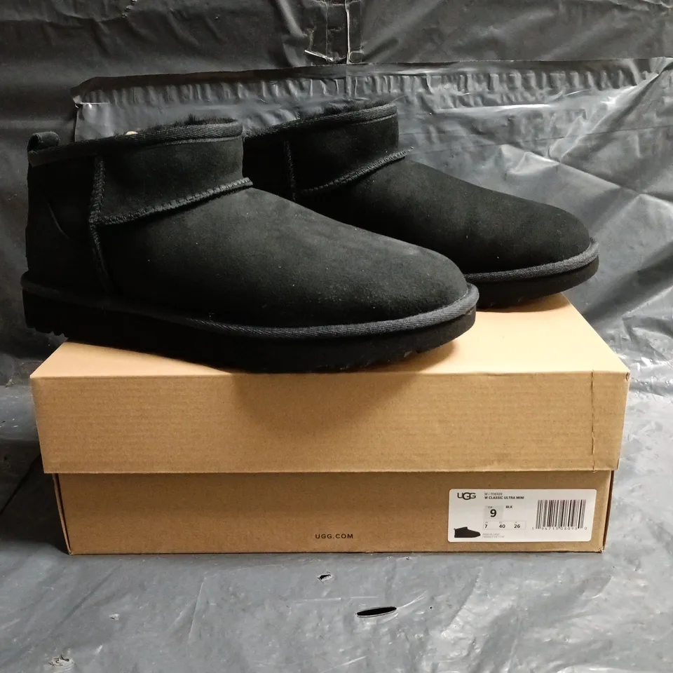 BOXED PAIR OF UGG CLASSIC ULTRA MINI SHOES IN BLACK SIZE UK 7