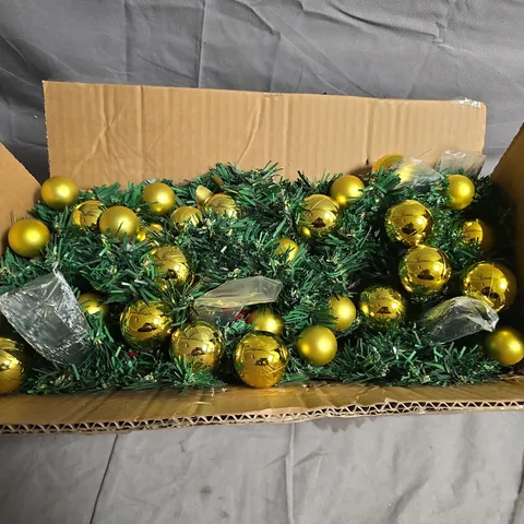 GOLD CHRISTMAS BAUBLES WITH GREEN GARLAND IN BOX