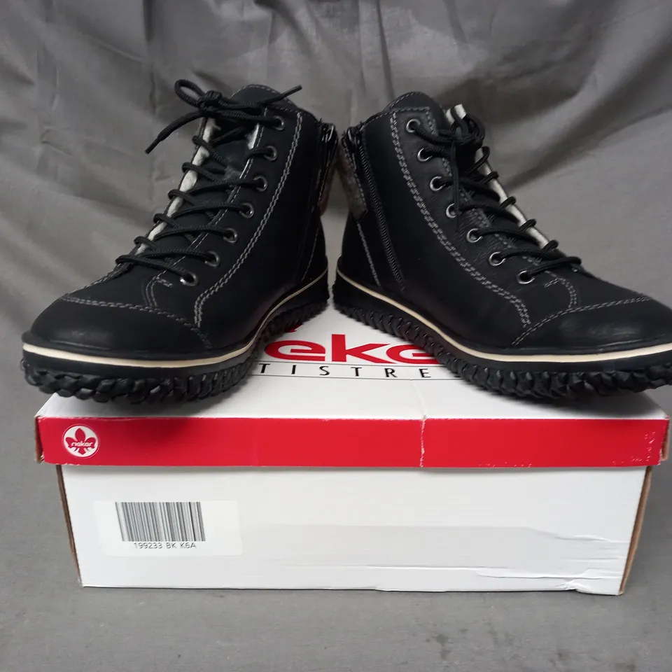 BOXED PAIR OF RIEKER WATER RESISTANT BOOTS IN BLACK SIZE 6.5
