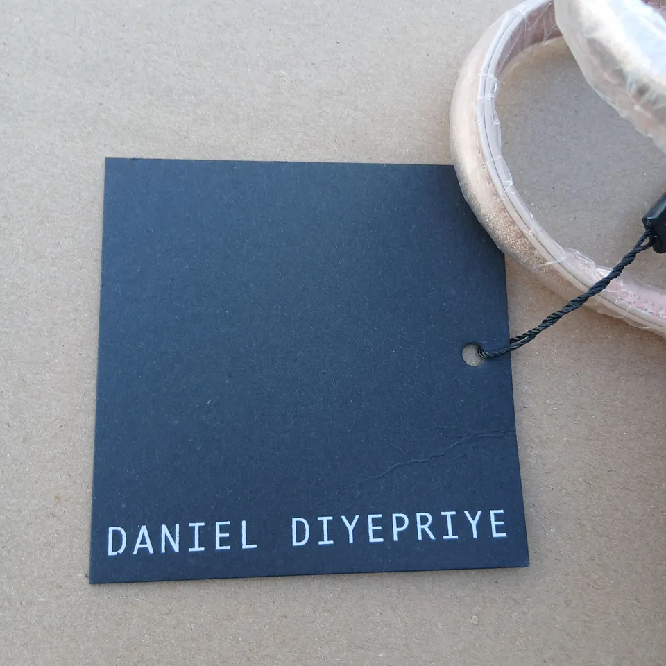 APPROXIMATELY FOUR DANIEL DIYEPRIYE METALLIC PINK HANDBAG