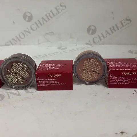LOT OF APPROXIMATELY 32 CLARINS OMBRE CREAM EYESHADOWS IN SILVER PINK, SILVER PLUM & NUDE BEIGE