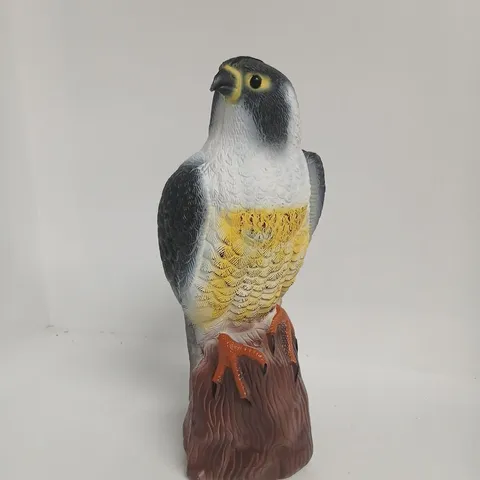 PLASTIC BIRD FIGURINE ON ROCK BASE