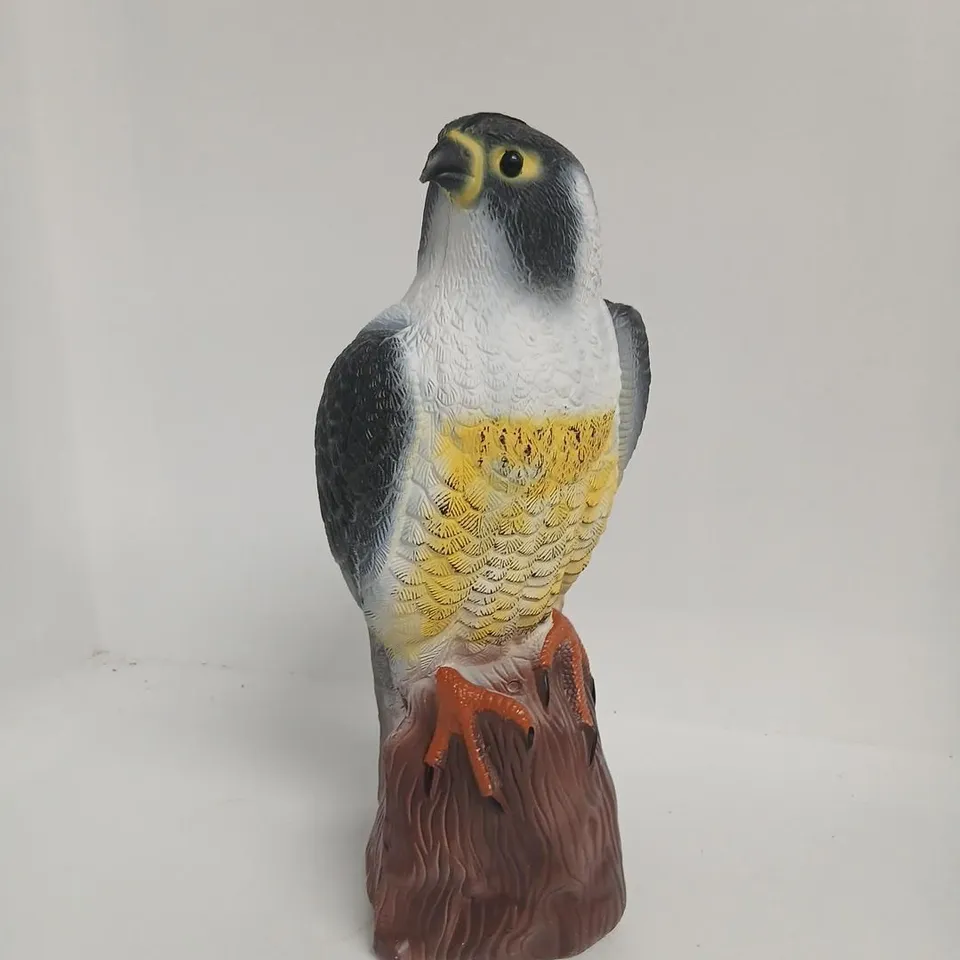 PLASTIC BIRD FIGURINE ON ROCK BASE