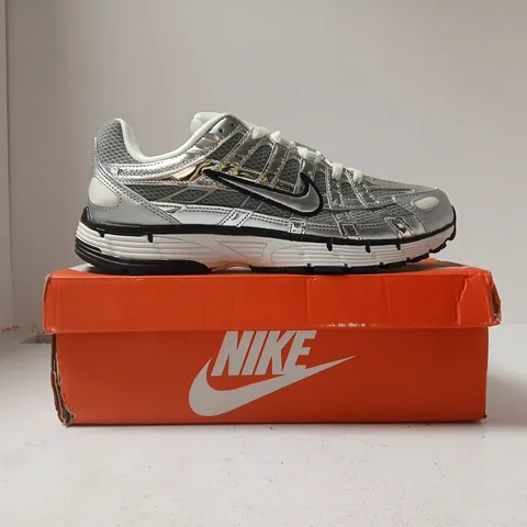 BOXED PAIR OF NIKE P-6000 TRAINERS IN METALLIC SILVER/GREY SIZE UK 9
