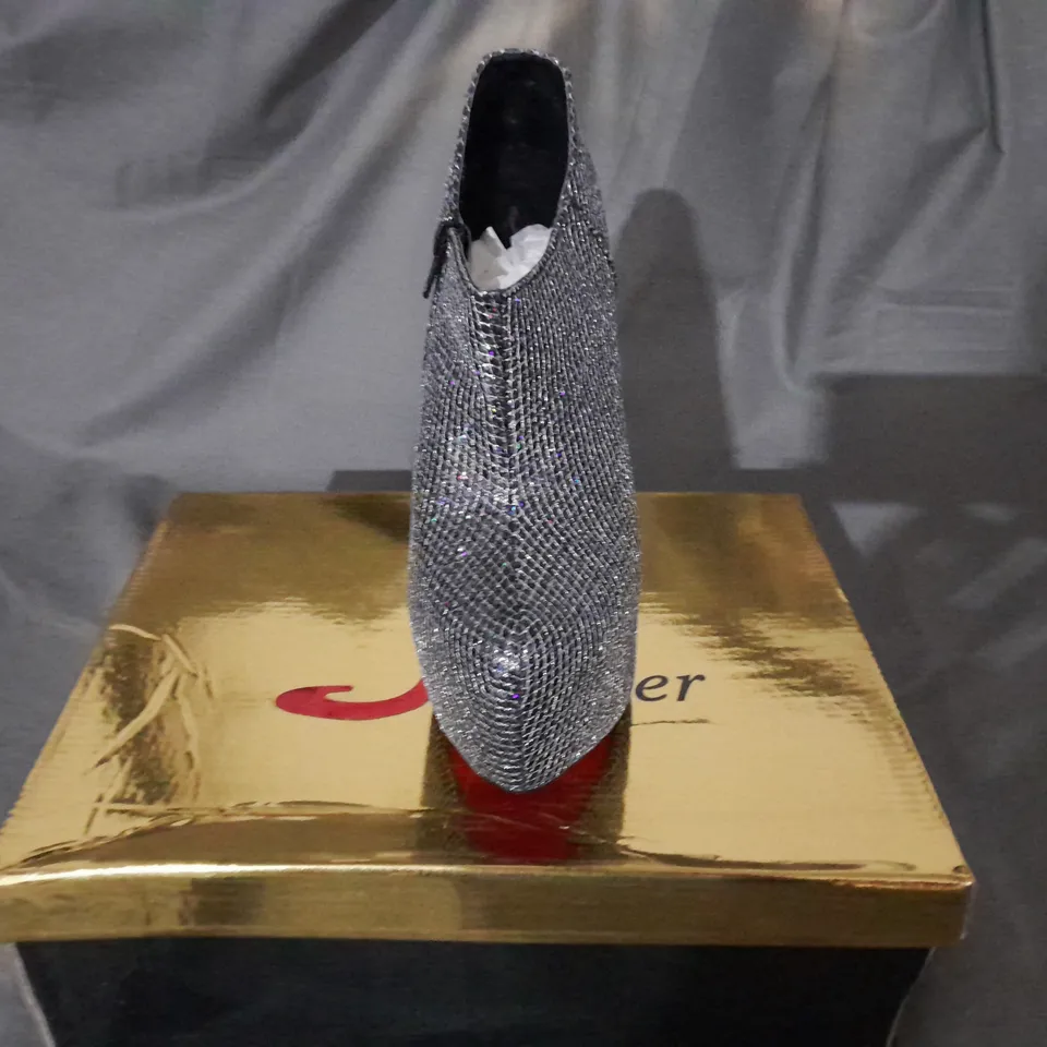 APPROXIMATELY 10 BOXED PAIRS OF SILVER HIGH HEEL BOOTS VARIOUS SIZES