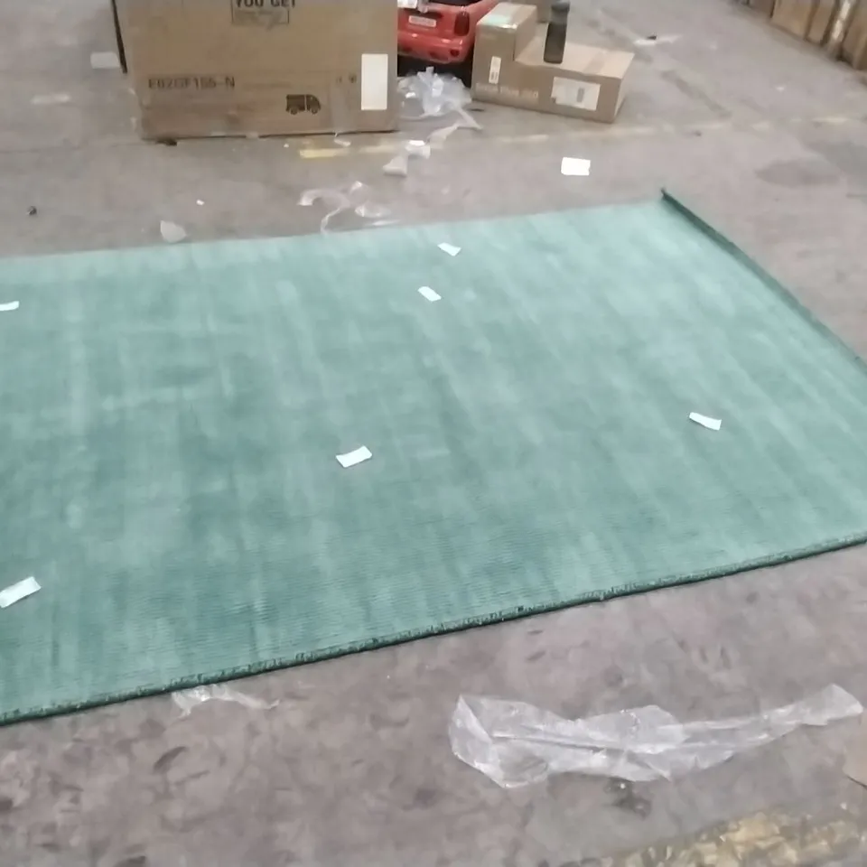 STILLAGE OF APPROXIMATELY 25 DESIGNER RUGS