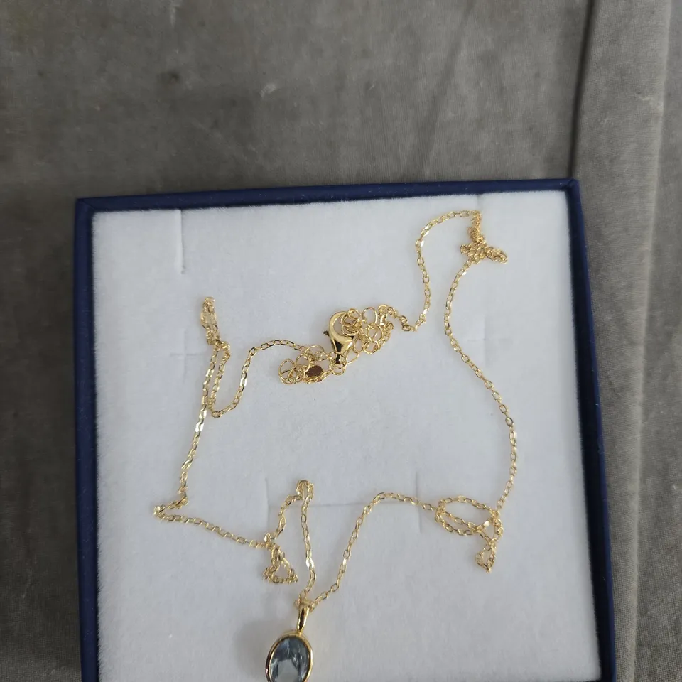 DIAMONIQUE GOLD TONE NECKLACE WITH BLUE PENDANT – BOXED