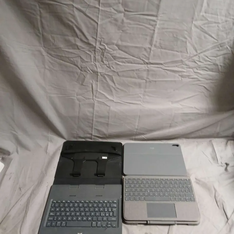 APPROXIMATELY 15 TABLET CASES AND KEYBOARDS FOR VARIOUS MAKES AND MODELS INCLUDING IPADS MODEL NUMBERS YU0086 AND YU0087 .