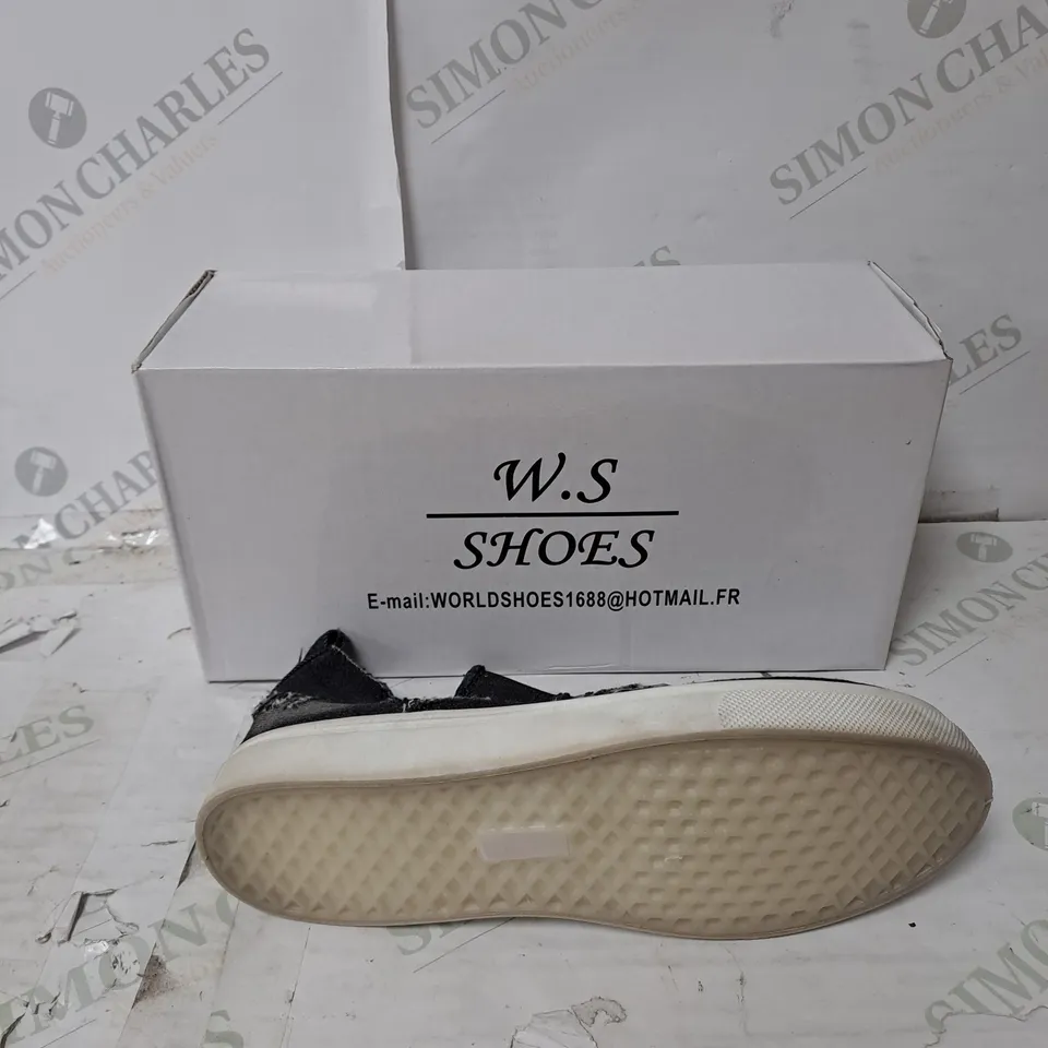 APPROXIMATELY 10 PAIRS  OF BOXED W.S SLIP ON BLACK DISTRESSED FLAT TRAINERS IN VARIOUS SIZES