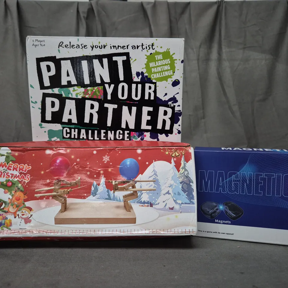 BOX OF APPROXIMATELY 15 ASSORTED TOYS AND GAMES TO INCLUDE PAINT YOUR PARTNER CHALLENGE, MAGNETS, ETC - COLLECTION ONLY