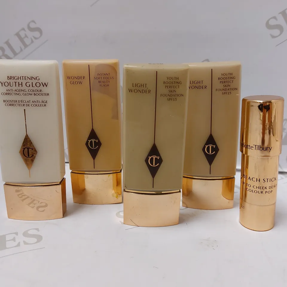 LOT OF 5 ASSORTED CHARLOTTE TILBURY PRODUCTS TO INCLUDE BRIGHTENING YOUTH GLOW BOOSTER, LIGHT WONDER PERFECT SKIN FOUNDATION M278, BEACH STICK MOON BEACH, ETC 