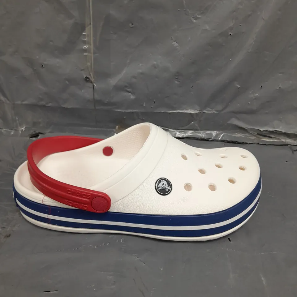 PAIR OF COCBAND CROCS IN WHITE SIZE 4
