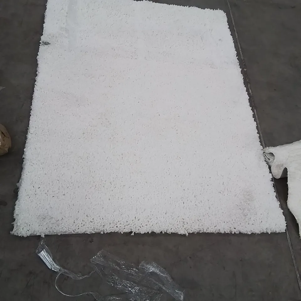 STILLAGE OF APPROXIMATELY 20 BAGGED QUALITY AREA RUGS