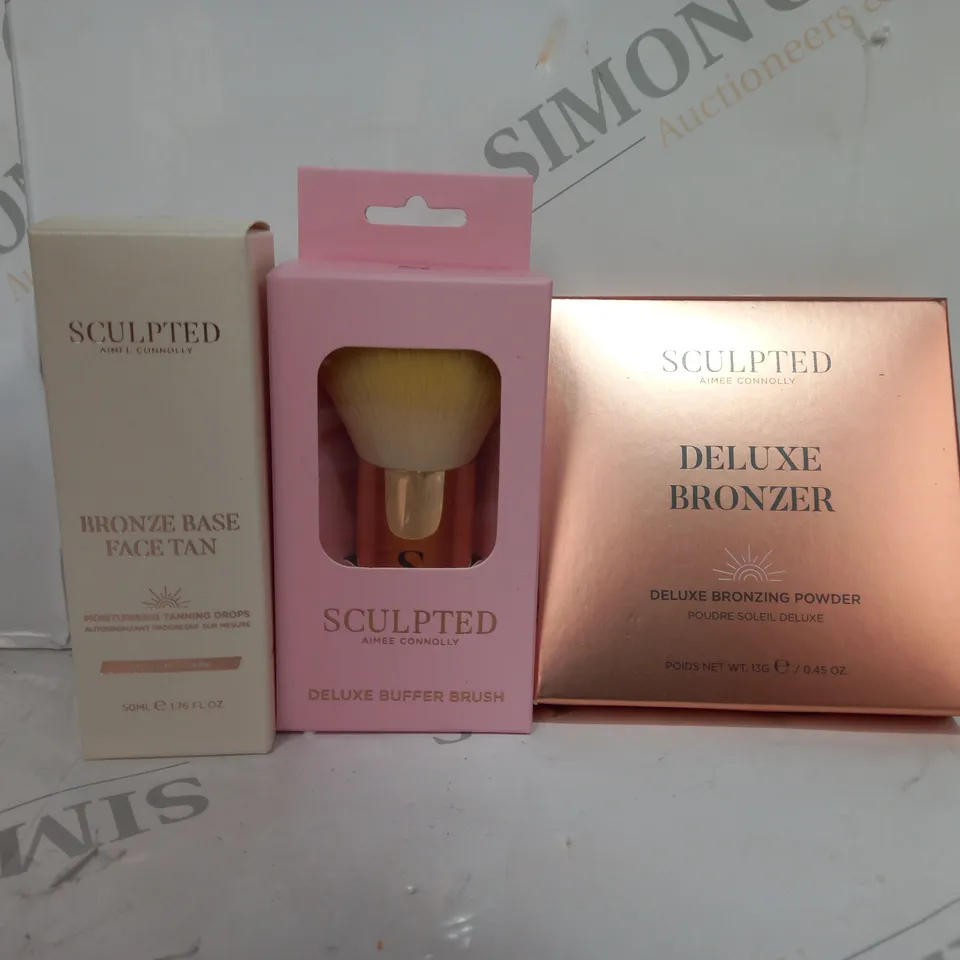 SET OF 3 SCULPTED ITEMS TO INCLUDE - DELUXE BRONZER - BRONZE BASE FACE TAN - BUFFER BRUSH 