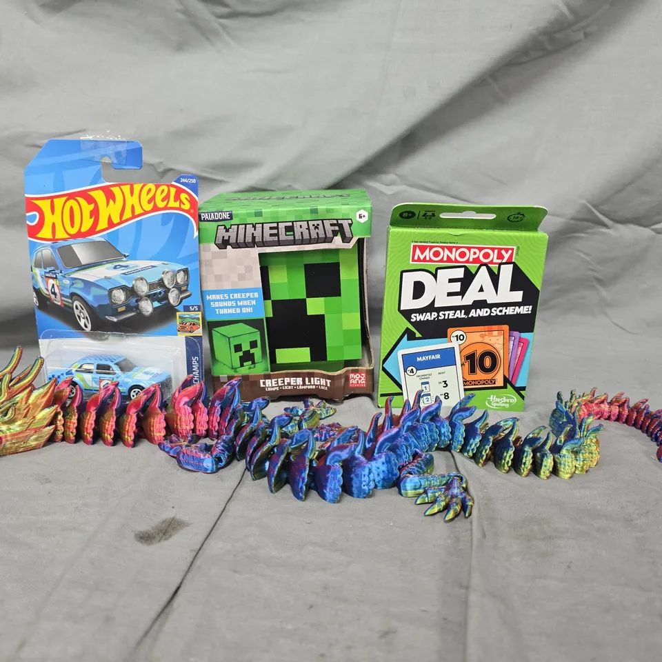 APPROXIMATELY 10 ASSORTED TOYS AND GAMES TO INCLUDE MINECRAFT CREEPER LIGHT, MONOPOLY DEAL, ETC