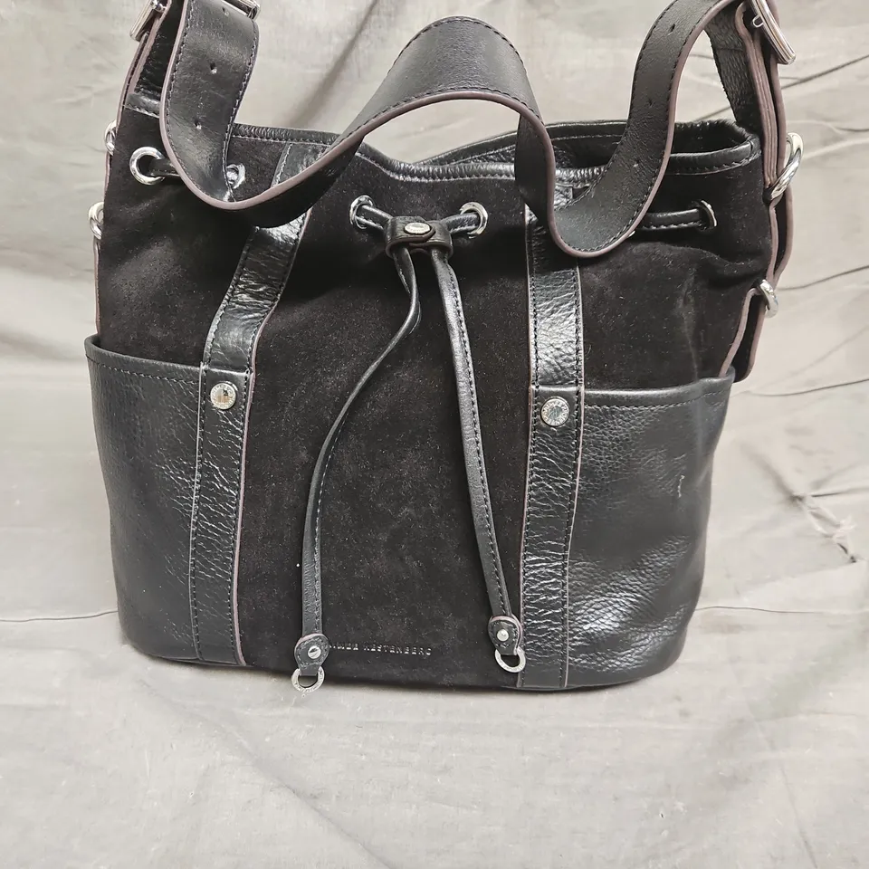 AK DRWSTRGN BUCK HAND BAG - IN BLACK