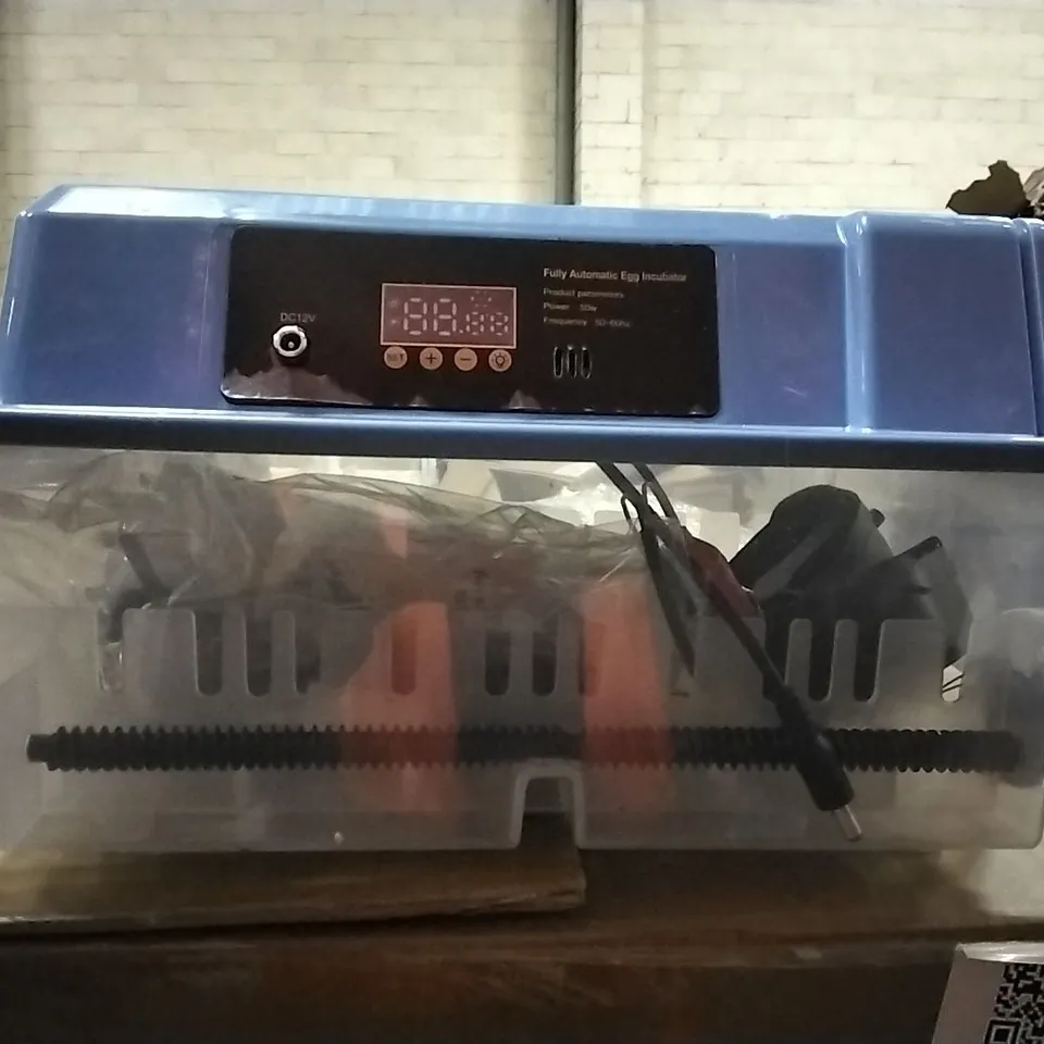 PALLET CONTAINING FLOOR TILES AND EGG INCUBATORS