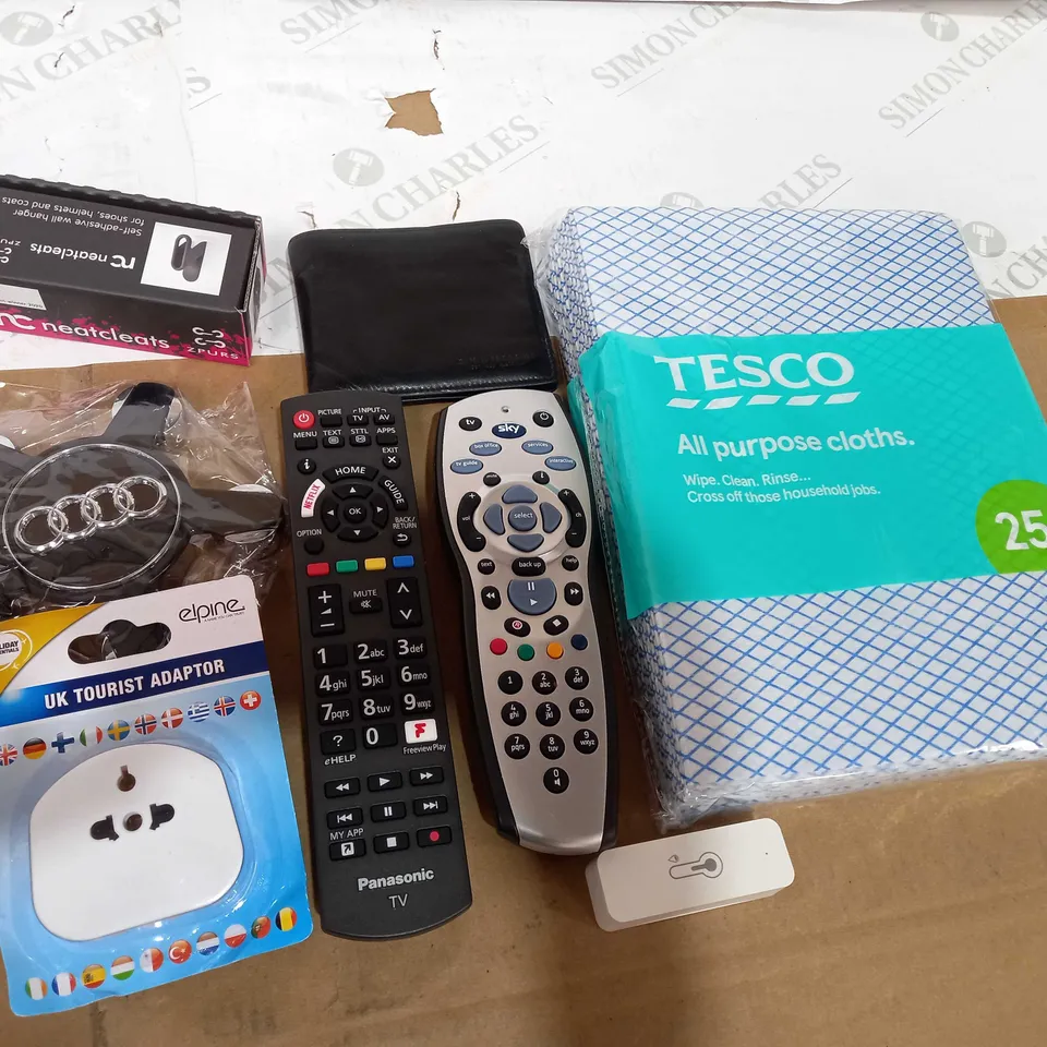BOX OF ASSORTED HOUSEHOLD ITEMS TOO INCLUDE TV REMOTES AND WALLETS 