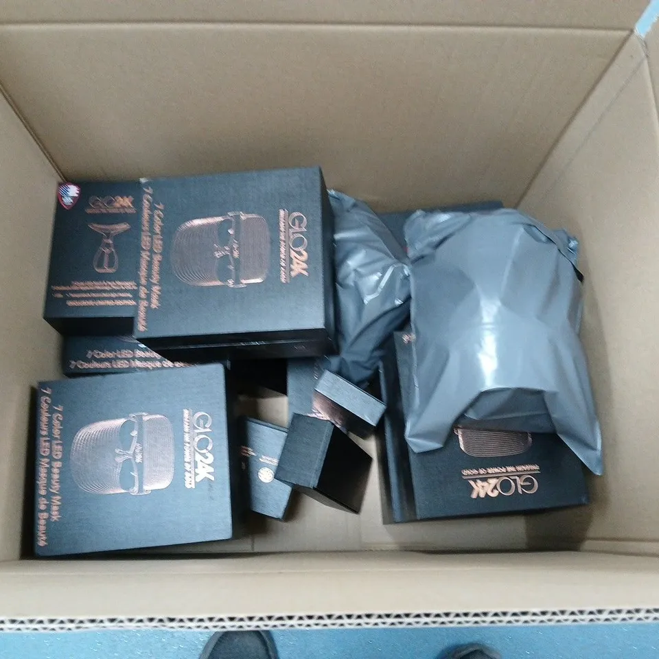 APPROXIMATELY 10 GLO24K BEAUTY PRODUCTS TO INCLUDE MASKS, WANDS AND A MASSAGER
