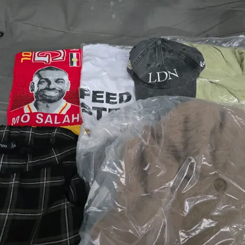 APPROXIMATELY 35 ASSORTED CLOTHING ITEMS IN VARIOUS SIZES, STYLES & COLOURS TO INCLUDE CAPS, FOOTBALL SCARFS, TROUSERS, ETC - COLLECTION ONLY