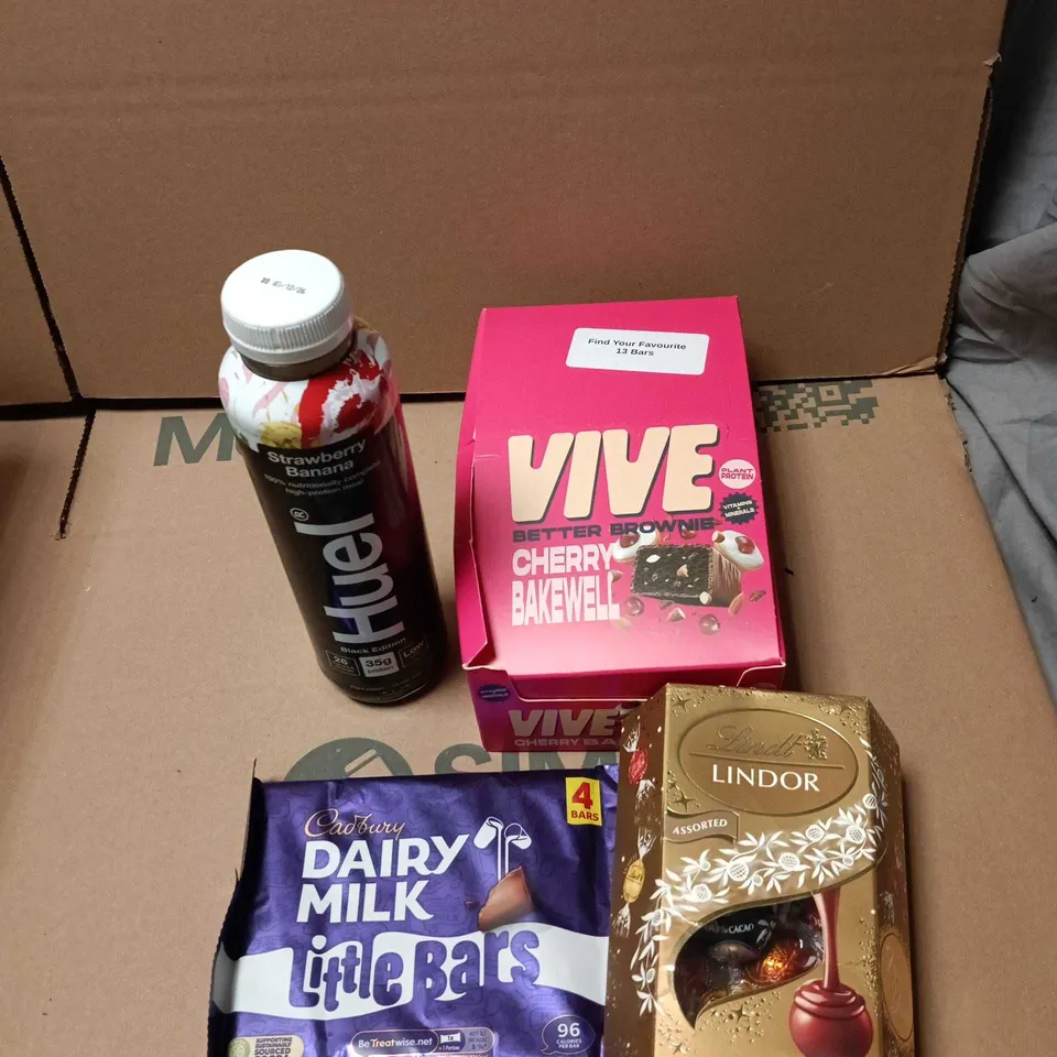 APPROXIMATELY 15 ASSORTED FOOD AND DRINK ITEMS TO INCLUDE VIVE BROWNIE PACK, HUEL, DAIRY MILK, LINDOR ETC