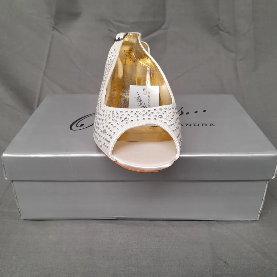 BOXED PAIR OF OCCASIONS BY CASANDRA OPEN TOE LOW HEEL ANKLE STRAP SHOES IN IVORY SATIN W. JEWEL EFFECT SIZE 7