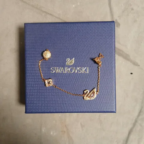SWAROVSKI BRACELET – ROSE GOLD TONE WITH CRYSTAL CHARMS