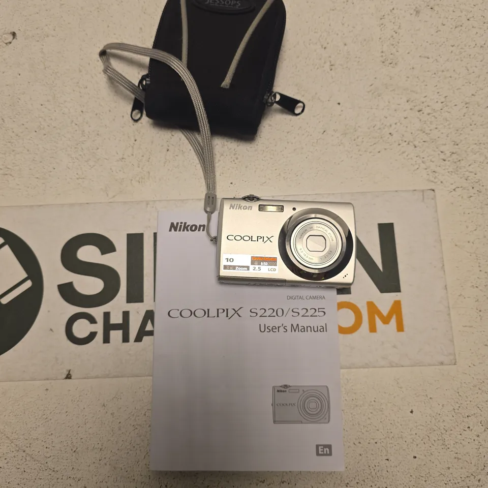 NIKON COOLPIX S220/S225 DIGITAL CAMERA WITH CASE, CHARGER & MANUALS (SILVER)