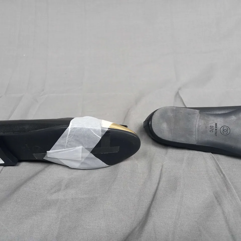 UNBOXED PAIR OF CHANEL SIZE 37C SLIP ON PUMPS IN BLACK/GOLD