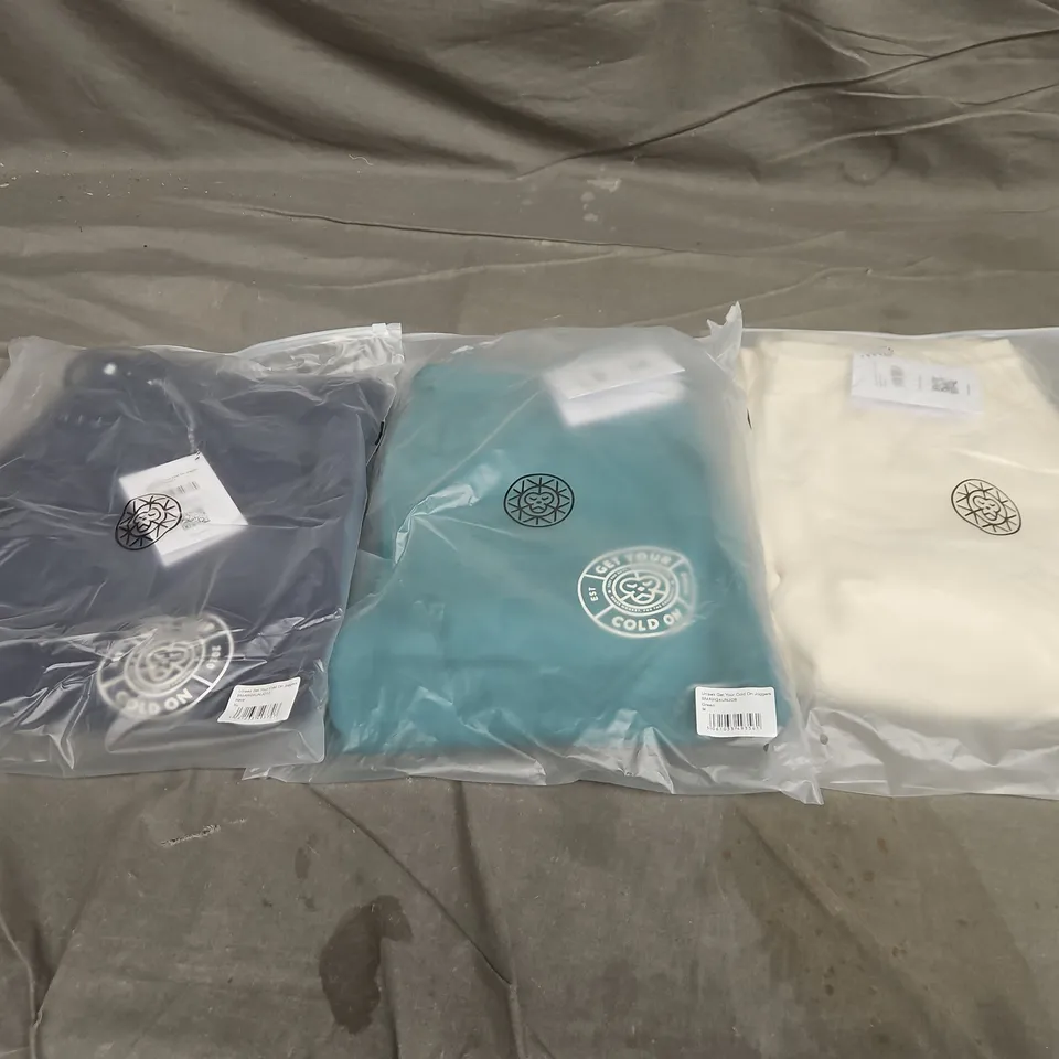 APPROXIMATELY 18 ASSORTED BAGGED CLOTHING ITEMS IN VARIOUS SIZES TO INCLUDE UNISEX GET YOUR COLD ON JOGGERS IN GREEN/NAVY & UNISEX BRASS MONKEY JOGGERS IN OFF WHITE