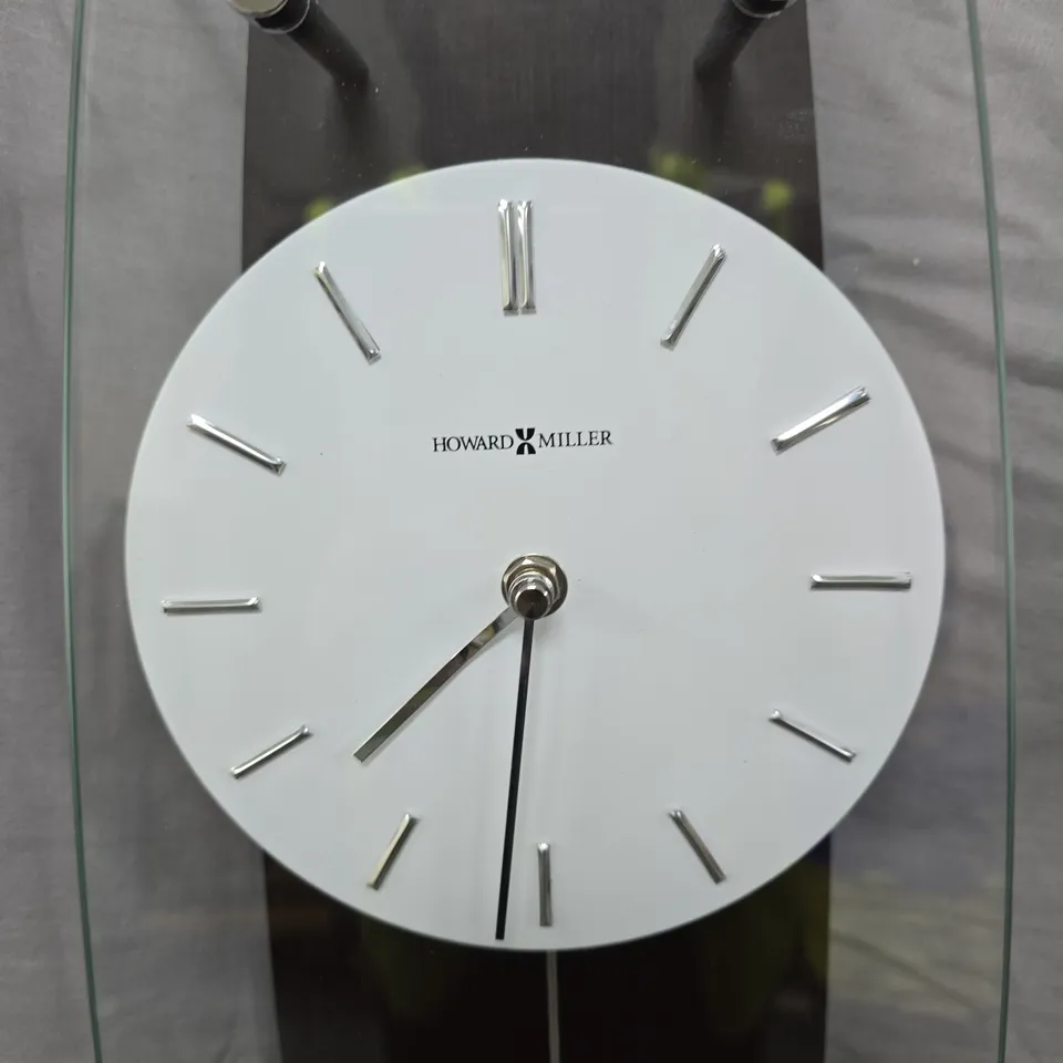 HOWARD MILLER WALL CLOCK – GLASS & DARK WOOD CASE WITH PENDULUM