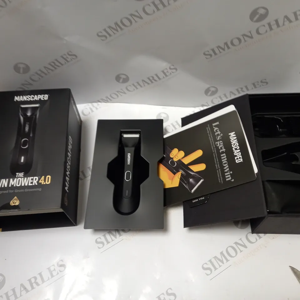BOXED MANSCAPED 'THE LAWN MOWER 4.0' SHAVER, WITH CHARGING DOCK, ACCESSORIES AND INSTRUCTIONS 