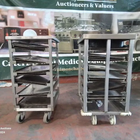 PAIR OF STAINLESS STEEL COMMERCIAL COOKING TRAY TROLLEYS WITH LARGE AMOUNT OF METAL OVEN TRAYS