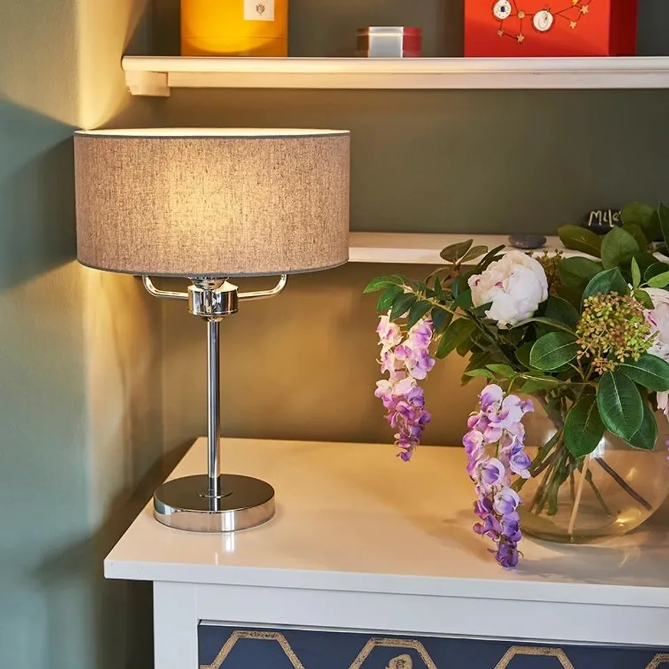 BOXED MELANCON 48CM BRUSHED CHROME TABLE LAMP WITH LINEN GREY DRUM SHADE (1 BOX)