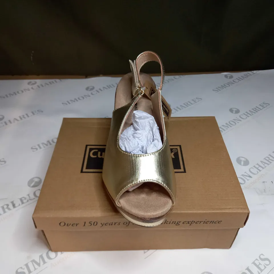BOXED PAIR OF CUSHION WALK GOLD WEDGE HEEL SHOES IN GOLD - SIZE 5