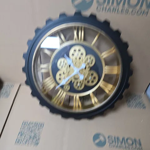 BLISS & BEYOND BLACK GEAR-FACE WALL CLOCK WITH GOLD ROMAN NUMERALS