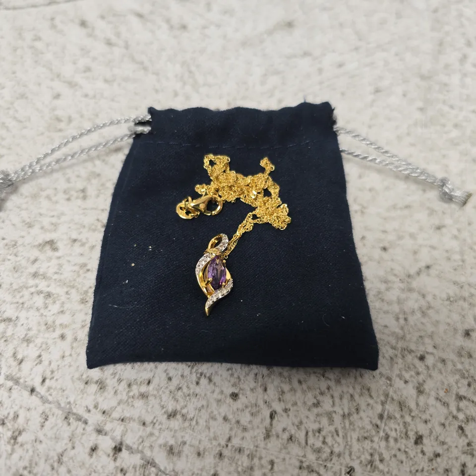 SILVER CIRCULAR RESIN KEYCHAIN AND GOLD-TONE LEAF PENDANT