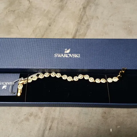 SWAROVSKI CRYSTAL BRACELET – GOLD-TONE TENNIS BRACELET IN BLUE BOX