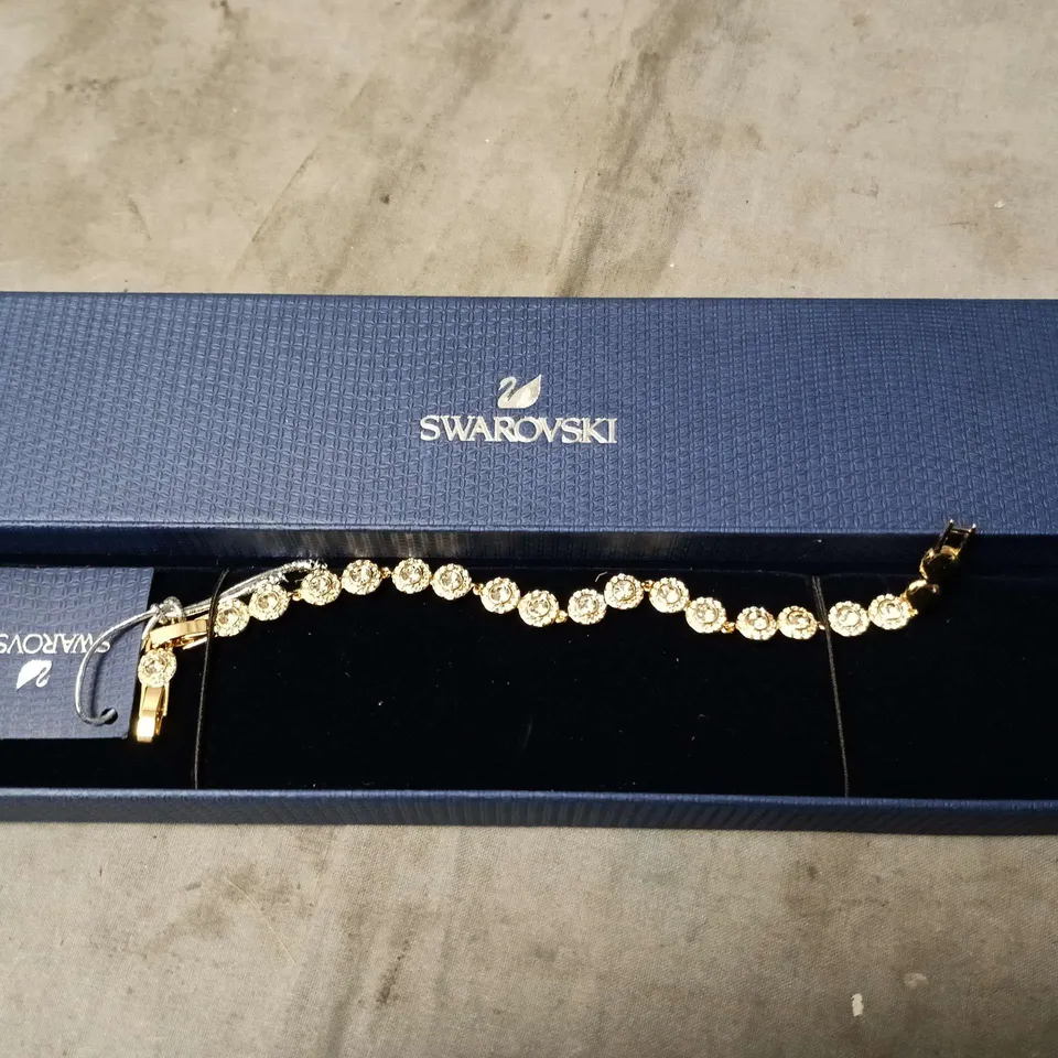 SWAROVSKI CRYSTAL BRACELET – GOLD-TONE TENNIS BRACELET IN BLUE BOX