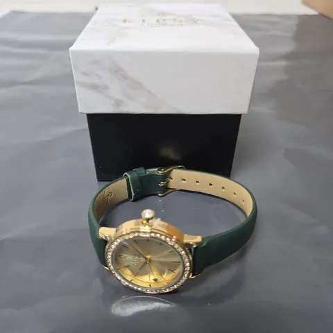 LIPSY LONDON WRISTWATCH – GOLD-TONE CASE, DIAMANTÉ BEZEL, GREEN STRAP 