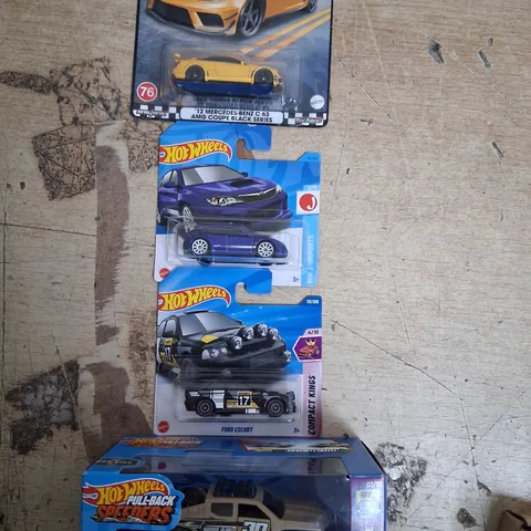 FOUR ASSORTED HOT WHEELS PRODUCTS TO INCLUDE; OFF DUTY, COMPACT KINGS, HW J IMPORTS AND 12 MERCEDES BENZ C 63 AMG COUPE BLACK SERIES
