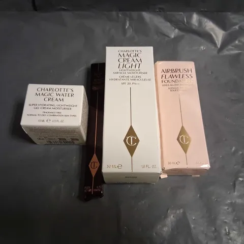 FOUR ASSORTED CHARLOTTE TILLBURY BEAUTY PRODUCTS TO INCLUDE; AIRBRUSH FLAWLESS FOUNDATION, MAGIC CREAM LIGHT, MAGIC WATER CREAM AND ROCK AND KOHL ICONIC LIQUID EYE PENCIL